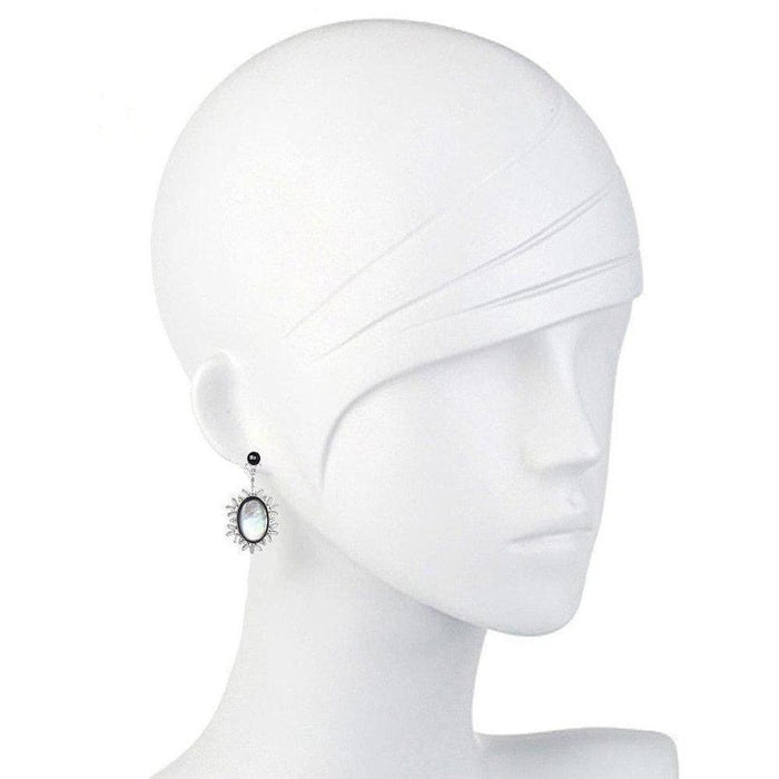 Elegant oval earrings; mother-of-pearl and onyx accents.