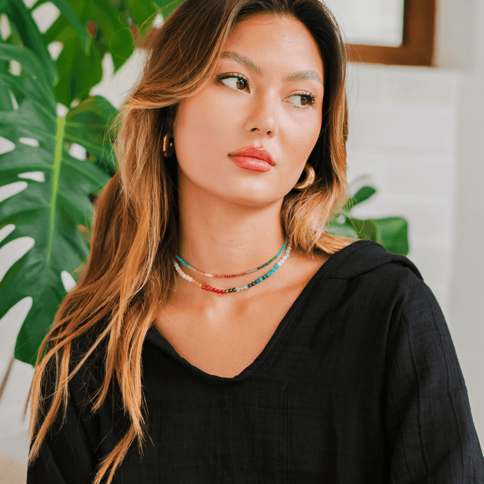 Model wearing 4mm multicolor stone healing necklace and a 2mm multicolor stone healing necklace
