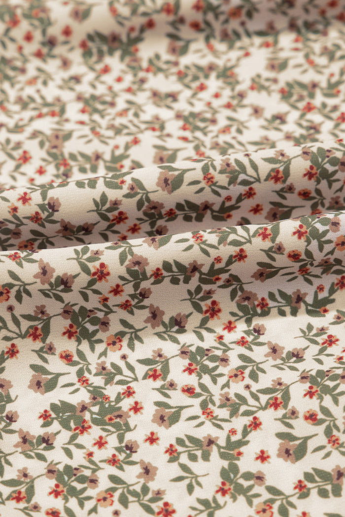 Haut smocké à manches bouffantes et imprimé floral