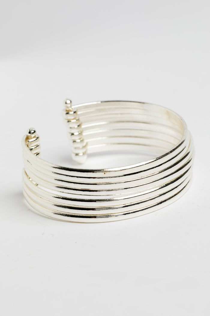 Bold statement wrist cuff in silver on white background