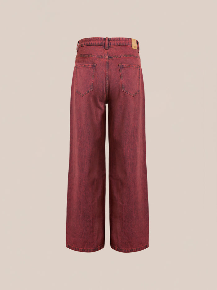 Back view of Lacy Baggy Jeans by FOUND, featuring a wide-leg design in vintage red wash denim made from 100% cotton, with two back pockets against a plain background.