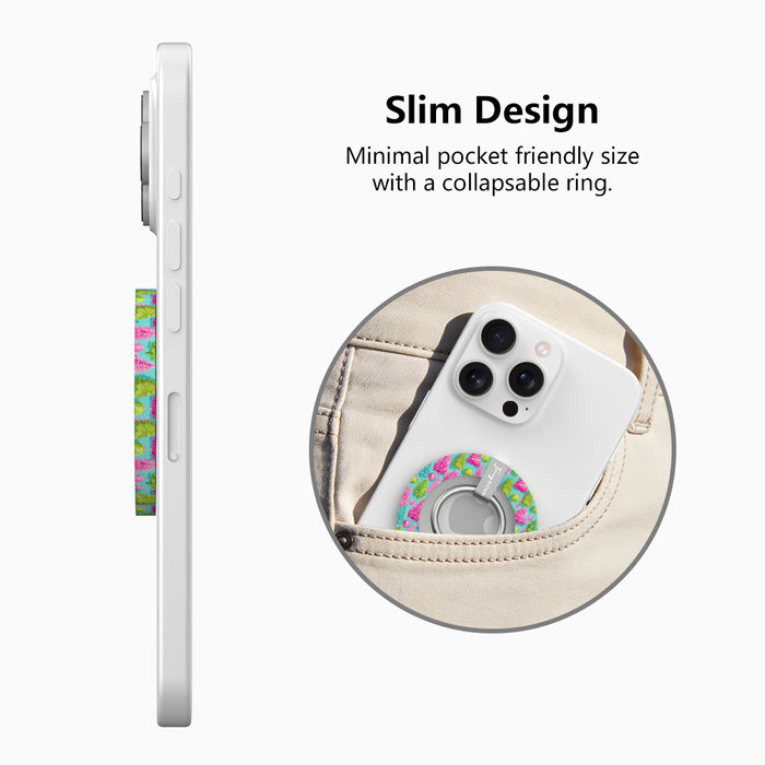 Side view of the slim Merry & Bright, Totally! grip ring with collapsible ring, and a phone with the Christmas tree grip sliding into a jeans pocket