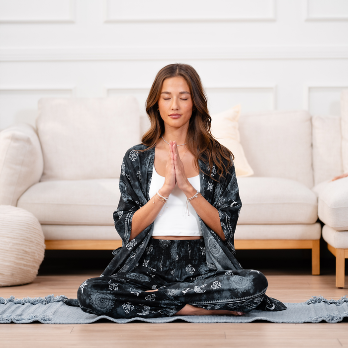 Midnight Lotus Moon Kimono, worn cross-legged in meditation