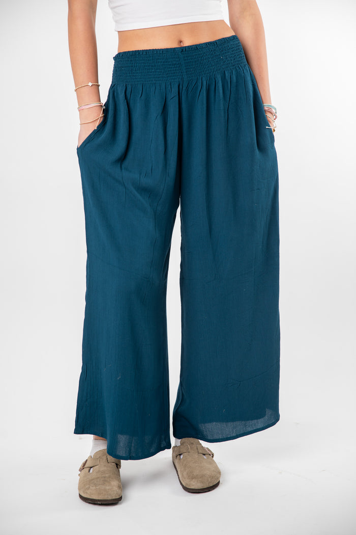 Ember is wearing size S/M wide leg pants in ocean blue