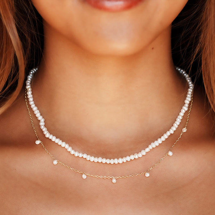 3mm Self Love Dewdrop Necklace, layered on neck