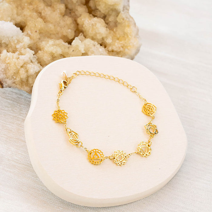 7 Chakras Bracelet, flat lay gold chain