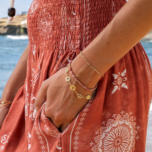 7 Chakras Bracelet, stacked on wrist by dress