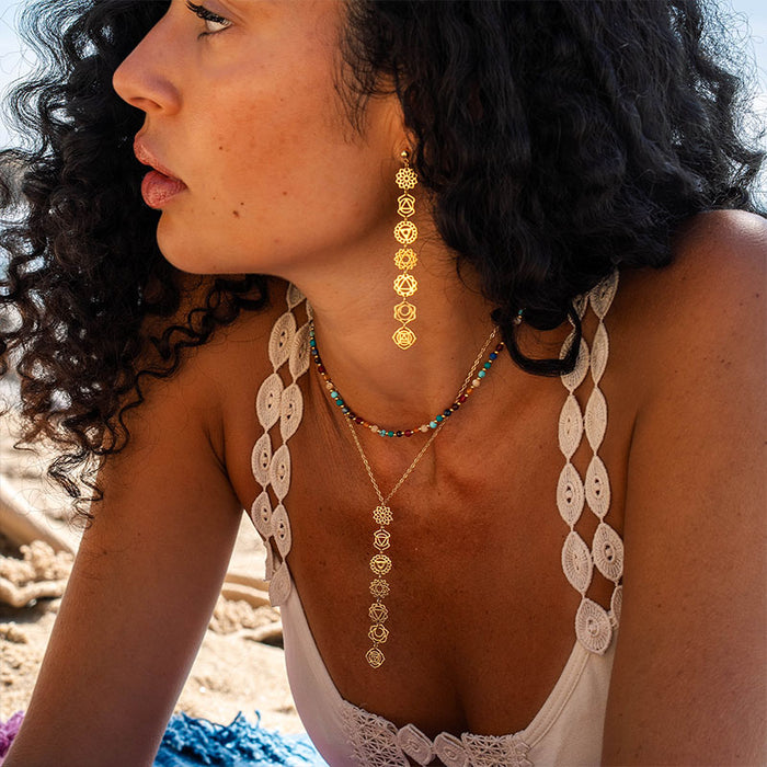 7 Chakras Drop Earrings, worn on the beach gold