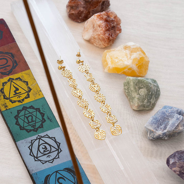 7 Chakras Drop Earrings, flat lay gold with crystals