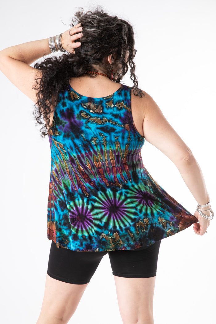 Susan is wearing a tie dye tank top in ocean