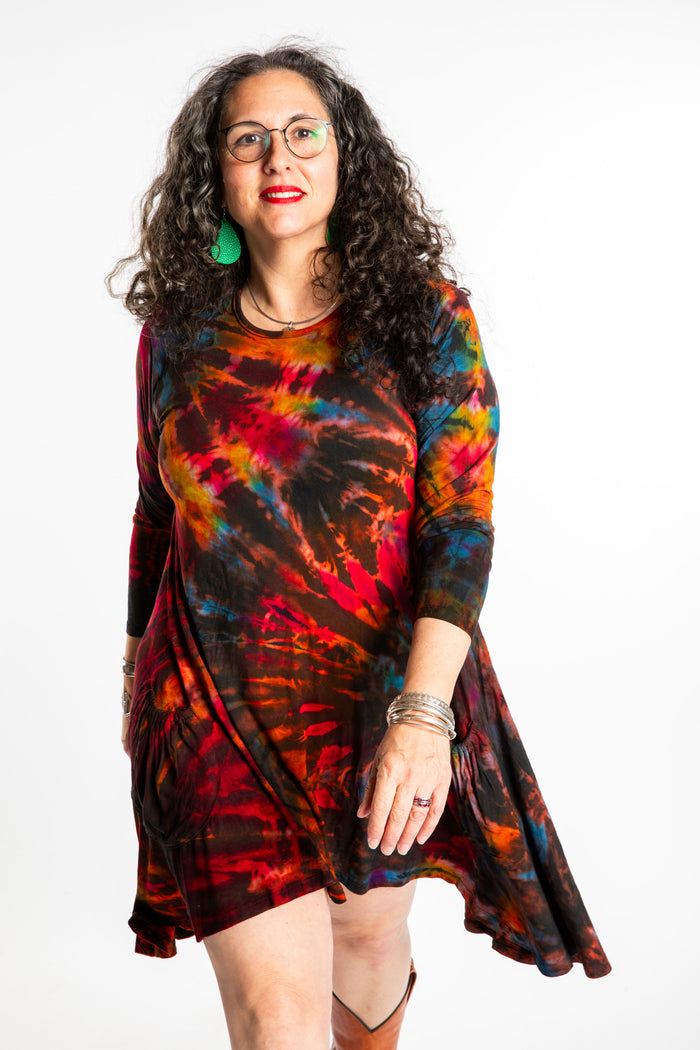 Susan wearing a long sleeve tie dye dress in the color Brown