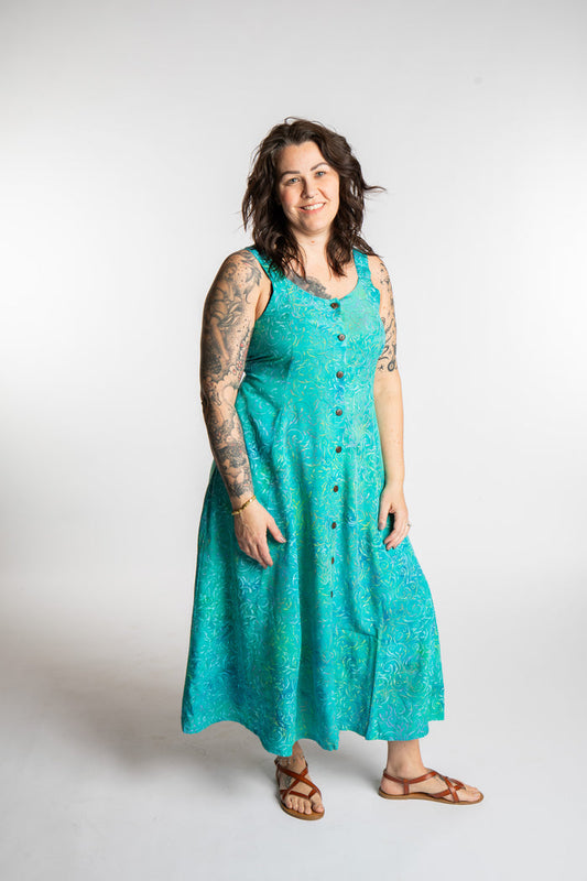 Morgan is wearing the Bright Teal Ani Button Batik Maxi Dress in size M