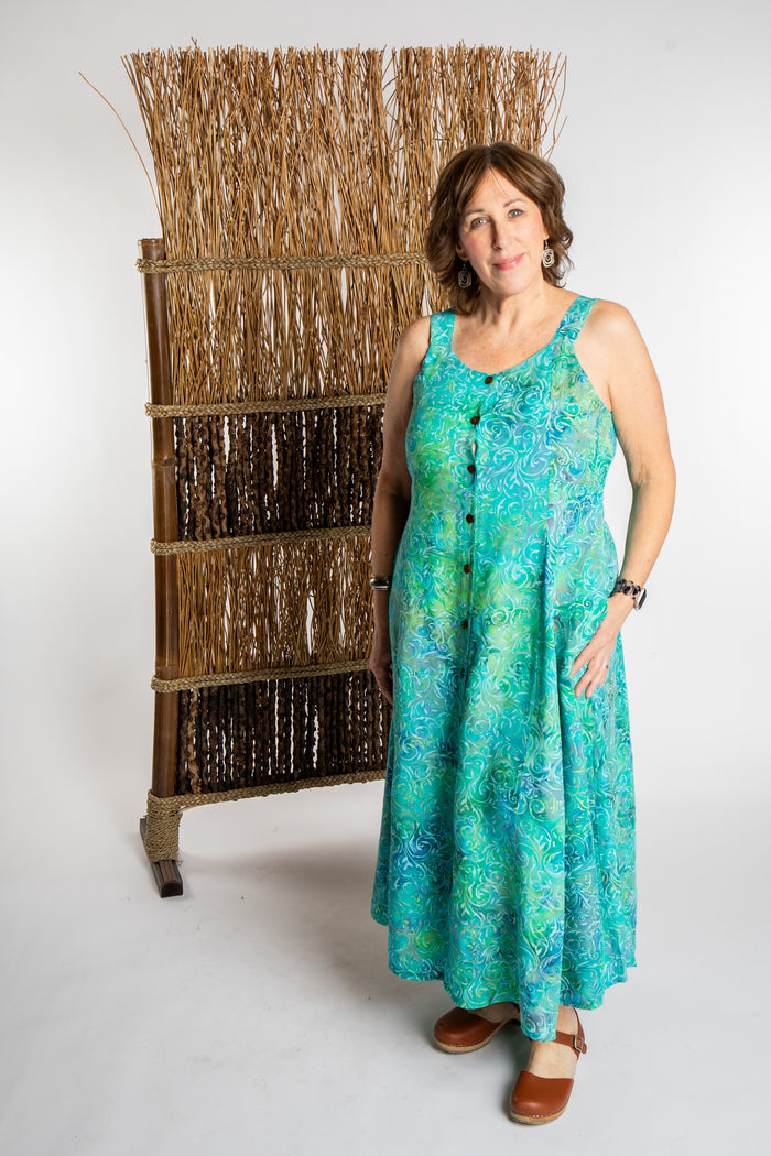 Betty is wearing the Bright Teal Ani Button Batik Maxi Dress in size L
