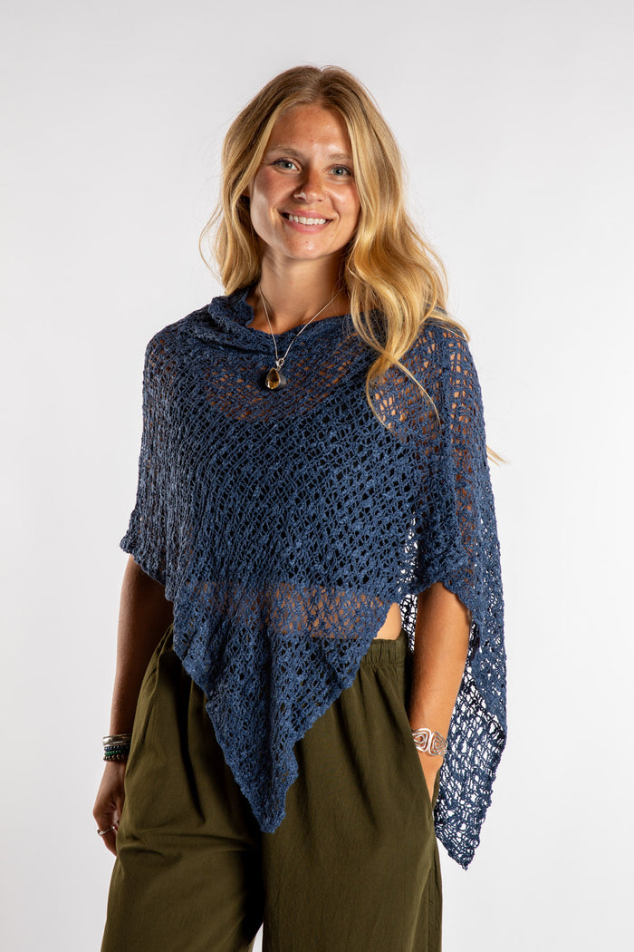 Sophie is wear the Asymmetrical Loose Weave Poncho in Navy