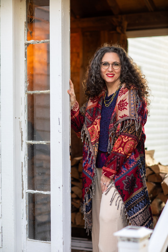 Susan wearing the Red multicolored patterned blanket jacket