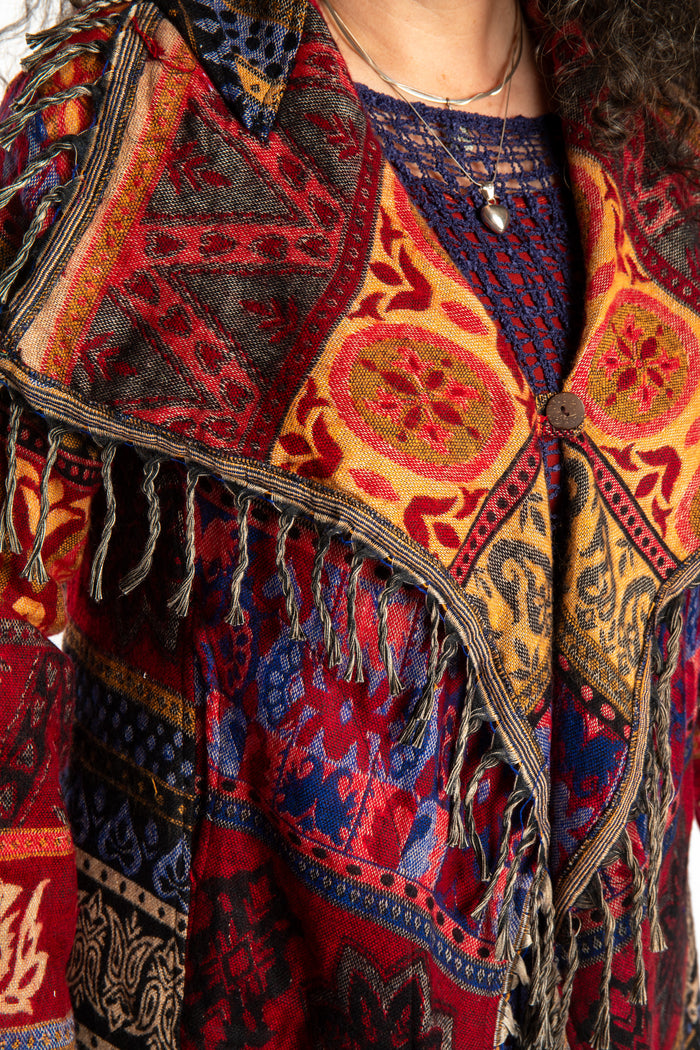 Susan wearing the Red multicolored patterned blanket jacket