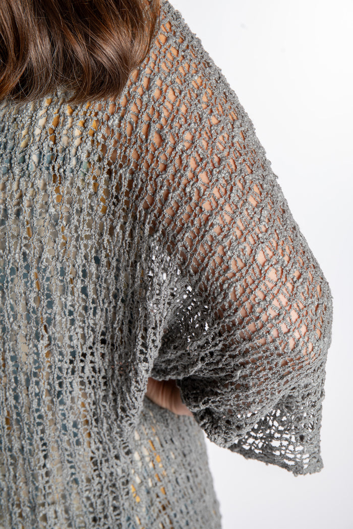Holly is wearing the Gray loose knit cover up