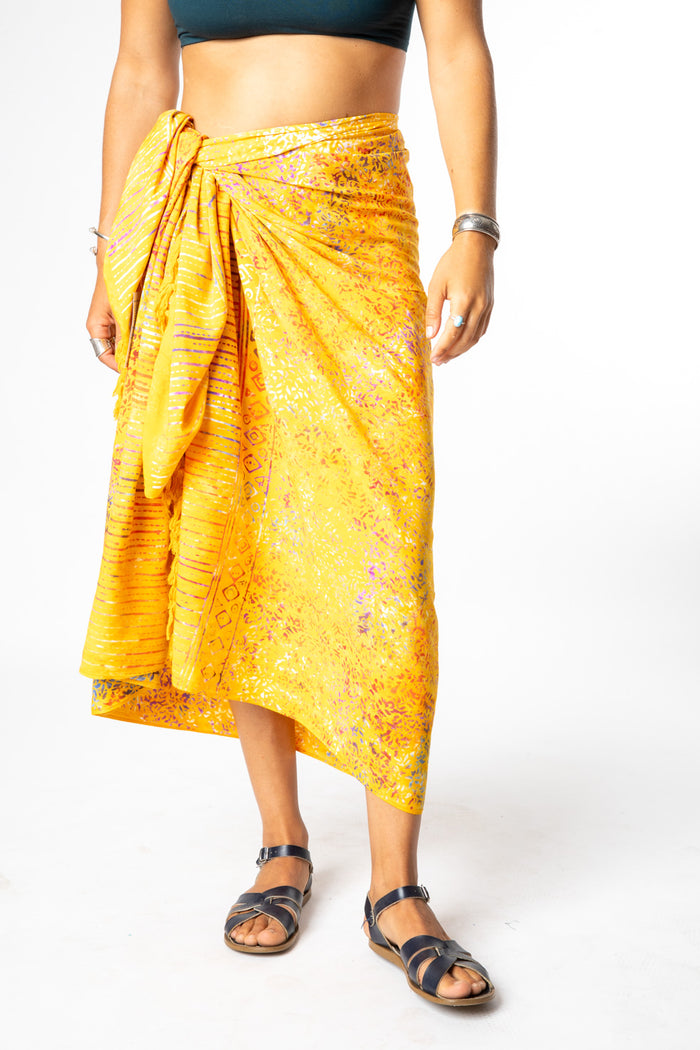 Sophie is wearing a batik sarong in sunlit shadows