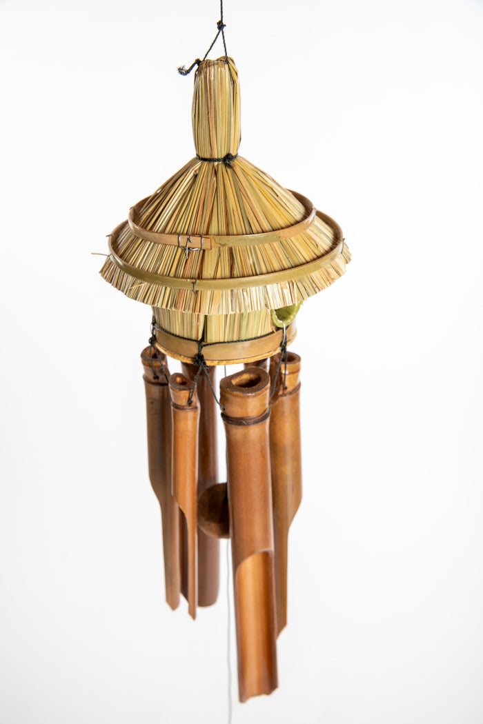Bamboo wind chime with a thatched roof design