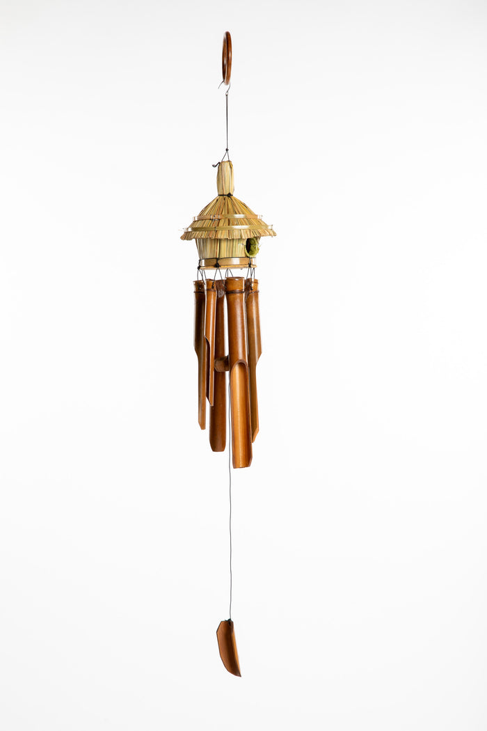 Bamboo wind chime with a thatched roof design