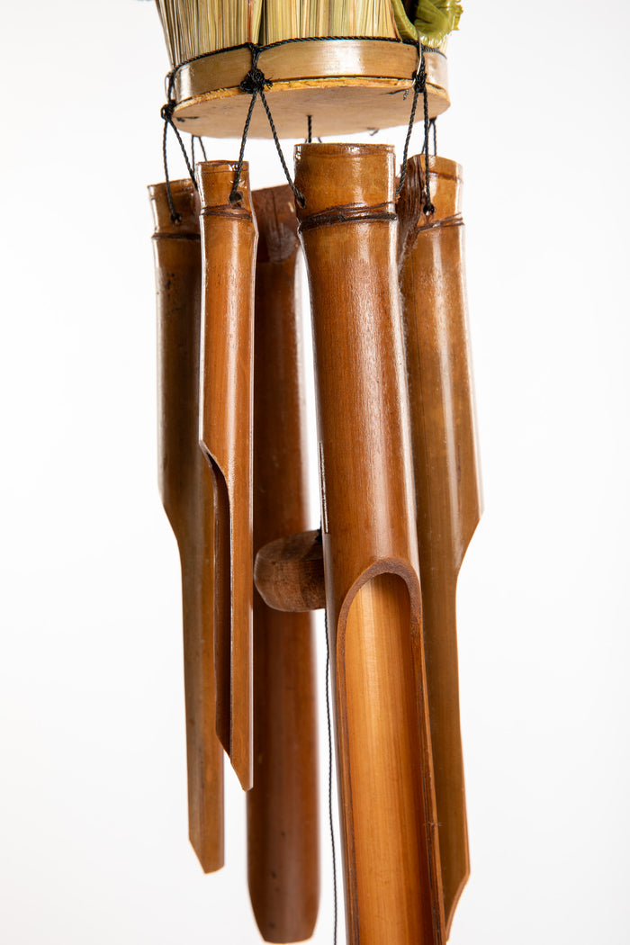 Bamboo wind chime with a thatched roof design