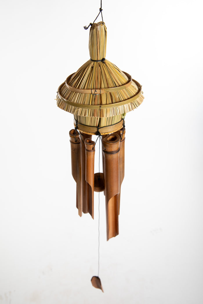 Bamboo wind chime with a thatched roof design