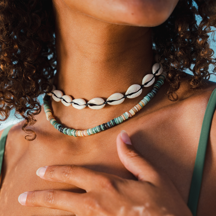 Black Cowry Shell Necklace, layered on neck