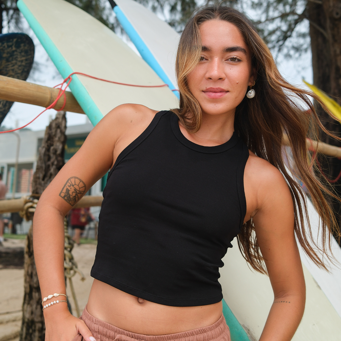 Black Cropped Rio Racerback Ribbed Tank, close-up on the beach