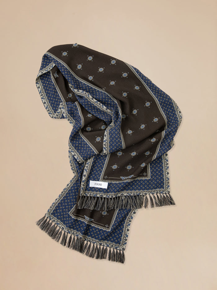 A Black Royal Blue Print Scarf with stars on it. (Found)