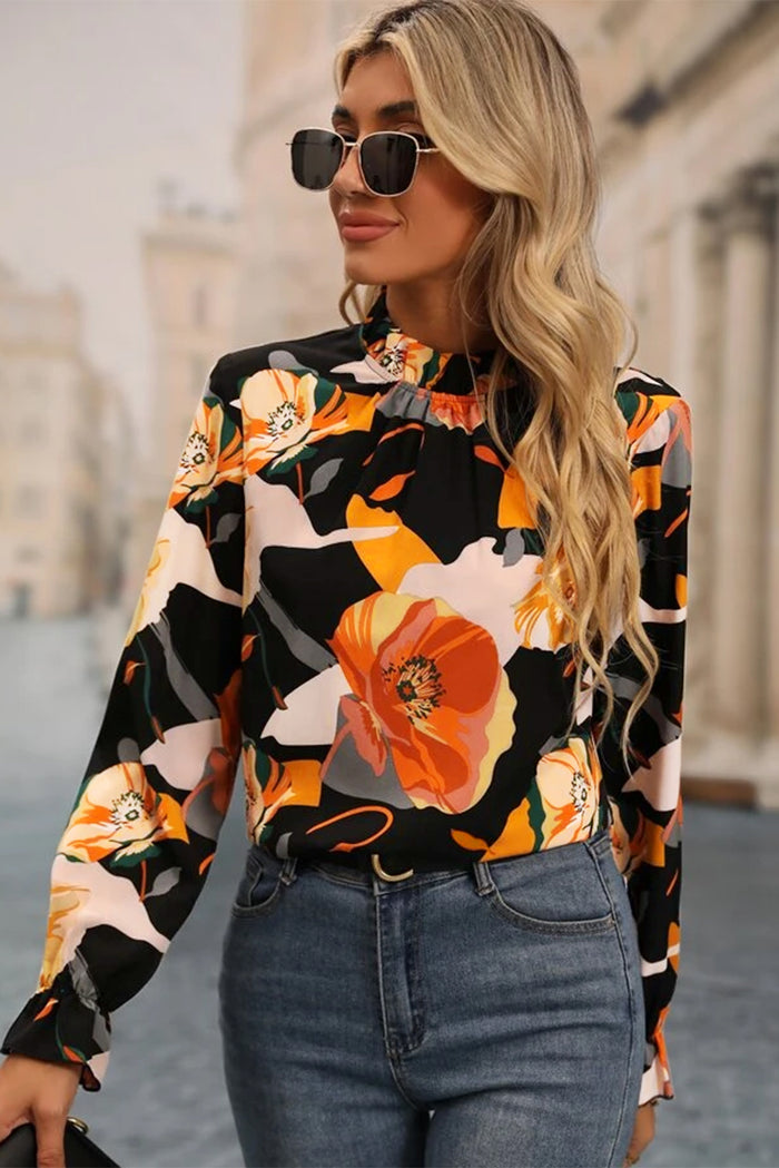 Blouse noire à col montant et imprimé floral-A WOMAN WE LOVE