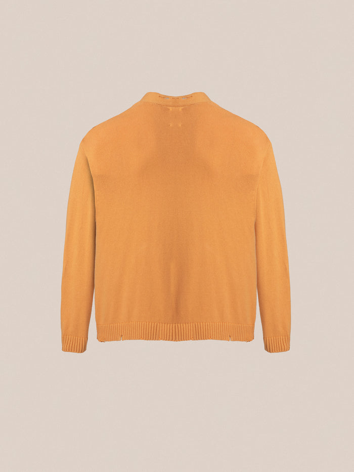 The back view of a Found Cadmium Distressed Cardigan.