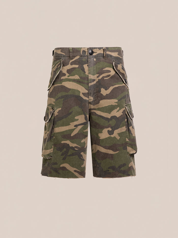 FOUND Camouflage Twill Utility Cargo Shorts feature a vintage green look, unisex relaxed fit, multiple pockets, button closure, and belt loops. Shown against a plain beige background.