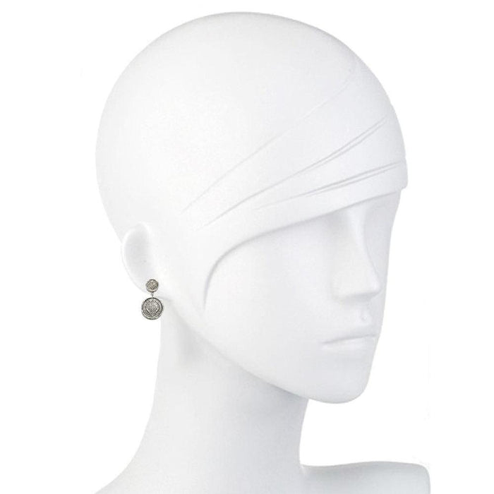 Double-circle pave diamond earrings on a mannequin.