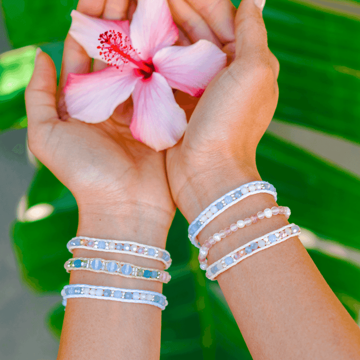 Celestial Bodies Healing Bracelet, worn holding flower