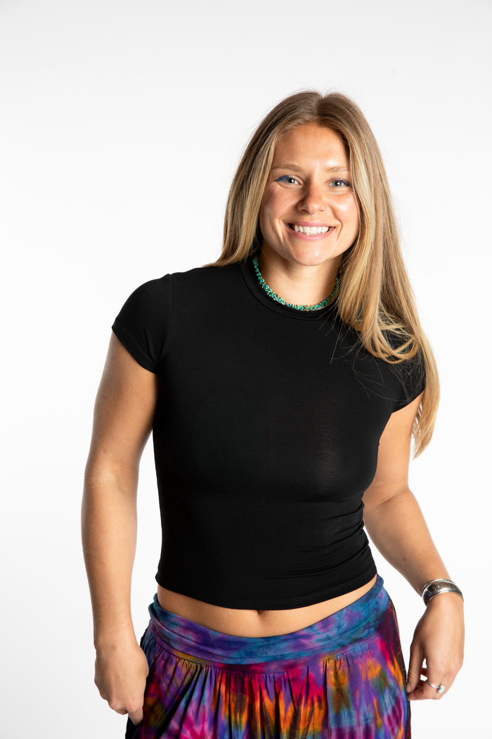 Sophie is wearing the S/M Black Chara Crew Neck Top