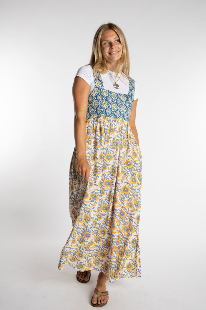 Sophie wearing the S/M Sunflower floral Flora Fusion maxi dress with cropped white chara top