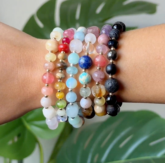 Choose Happiness Statement Healing Bracelet, stacked on wrist by leaf