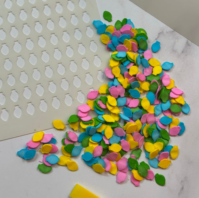 Christmas Lights Sprinkle Stencil, made in four bright colors for dessert decorating.