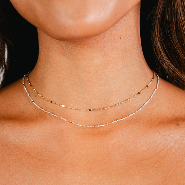 Circles in the Sand Necklace, layered on neck