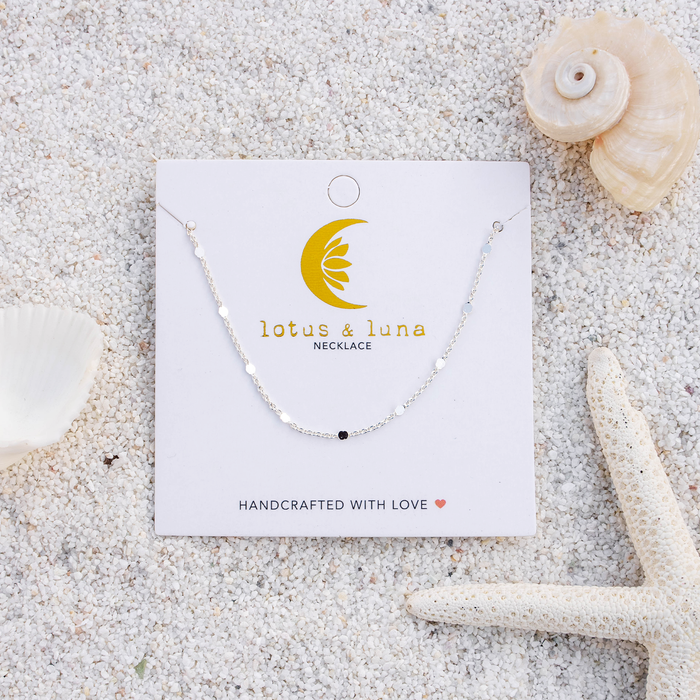 Circles in the Sand Necklace, flat lay silver chain