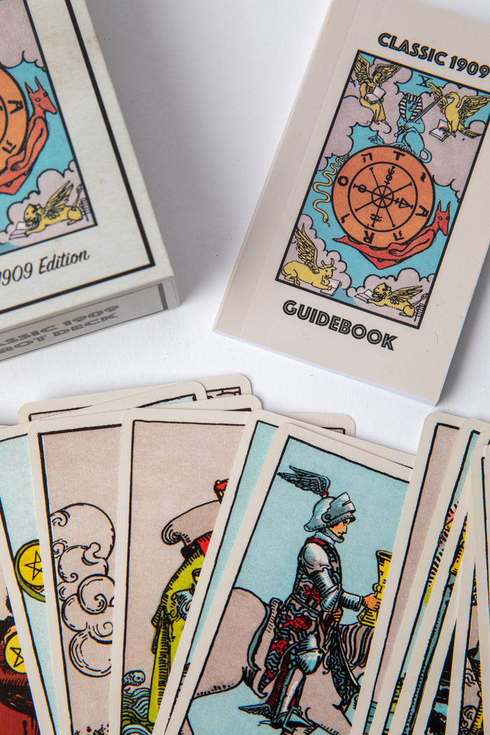 88-page tarot guidebook included with Classic 1909 Tarot Deck shown beside cards for intuitive readings