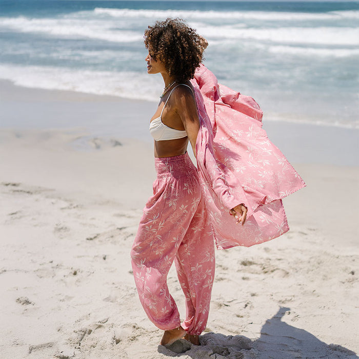 Coral Bloom Butterfly Kimono, worn walking on the beach