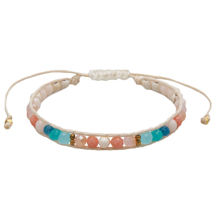 Coral Kiss Healing Bracelet, flat lay cotton cord