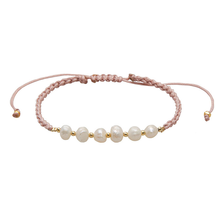 Coral Mermaids Pearl Bracelet, flat lay pink cord