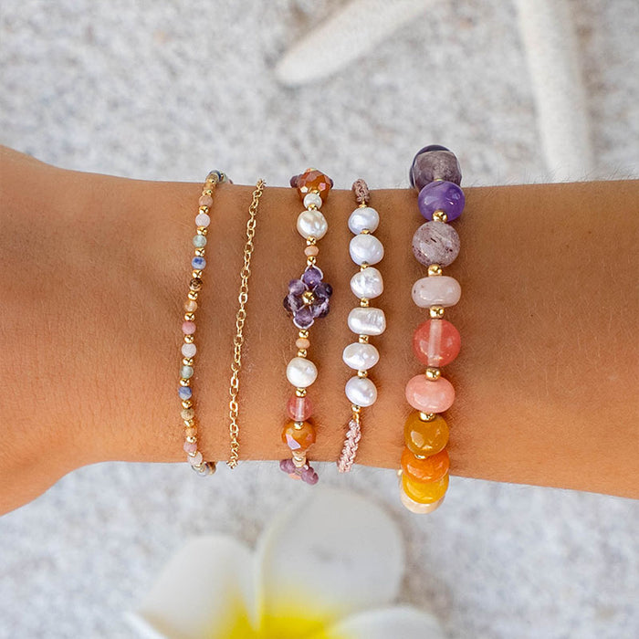 Coral Mermaids Pearl Bracelet, wrist stack on sand