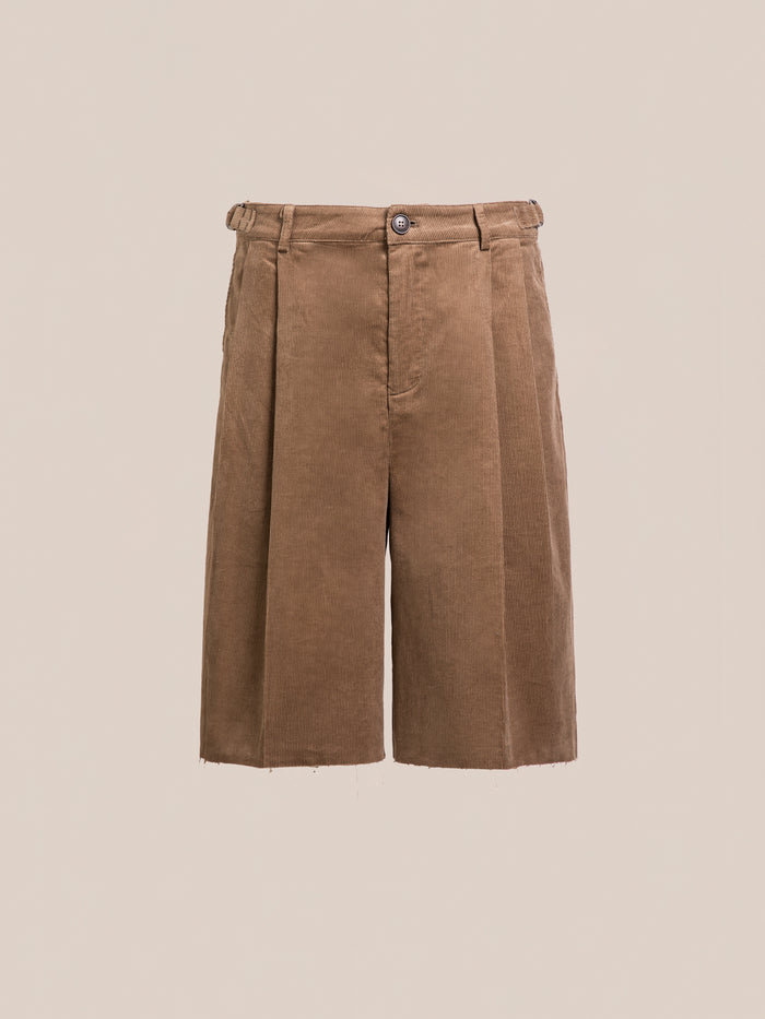 FOUND Corduroy Pleated Trouser Shorts in brown feature double pleats, button and zip closure, unisex relaxed fit, and belt loops, displayed on a plain beige background.