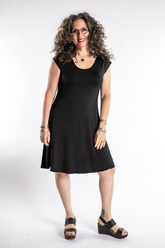 Susan is wearing the Dancing Daze Dress in Black in Medium