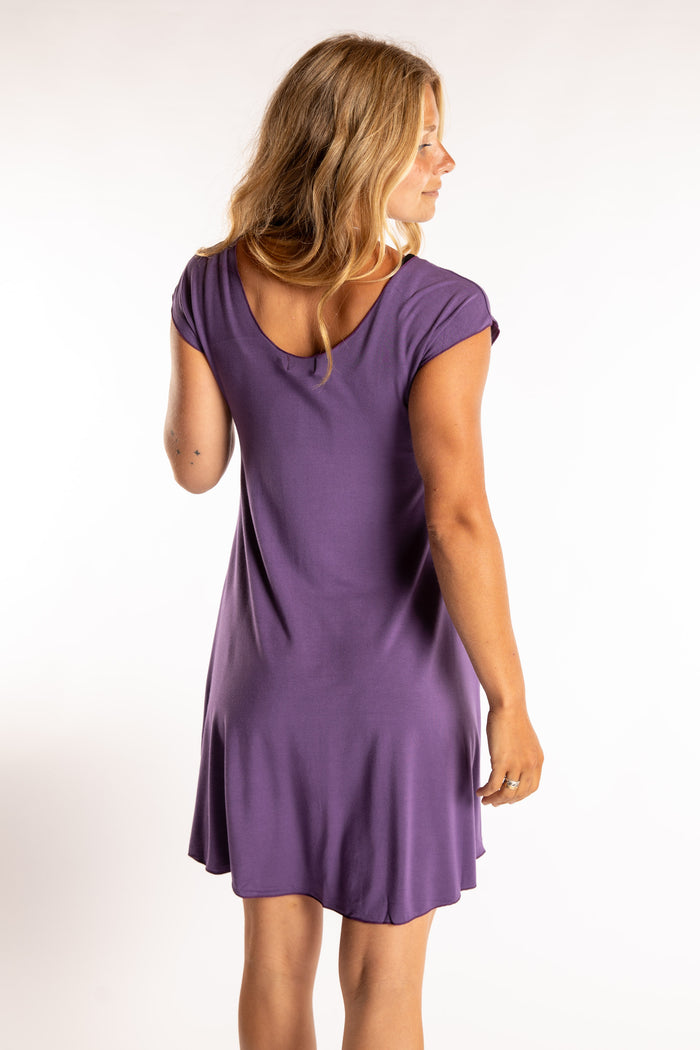 Sophie is wearing the Dancing Daze Dress in Eggplant in Small
