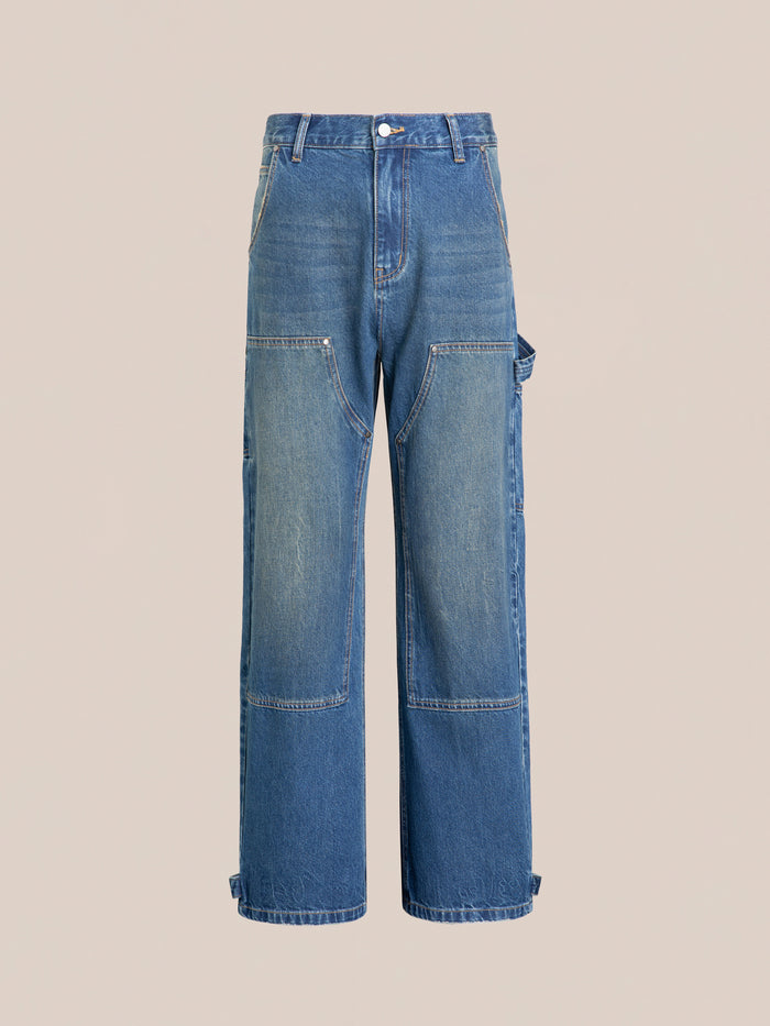 Front view of FOUND's Denim Carpenter Jeans in blue with a relaxed straight-leg fit, vintage-inspired wash, multiple pockets, and button closure on a plain background.