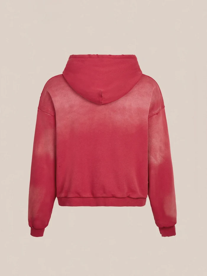 The FOUND Distressed Thermal Lined Zip Up Hoodie features a unisex relaxed fit, hood and long sleeves. Shown from the back in red tie-dye against a plain light background.